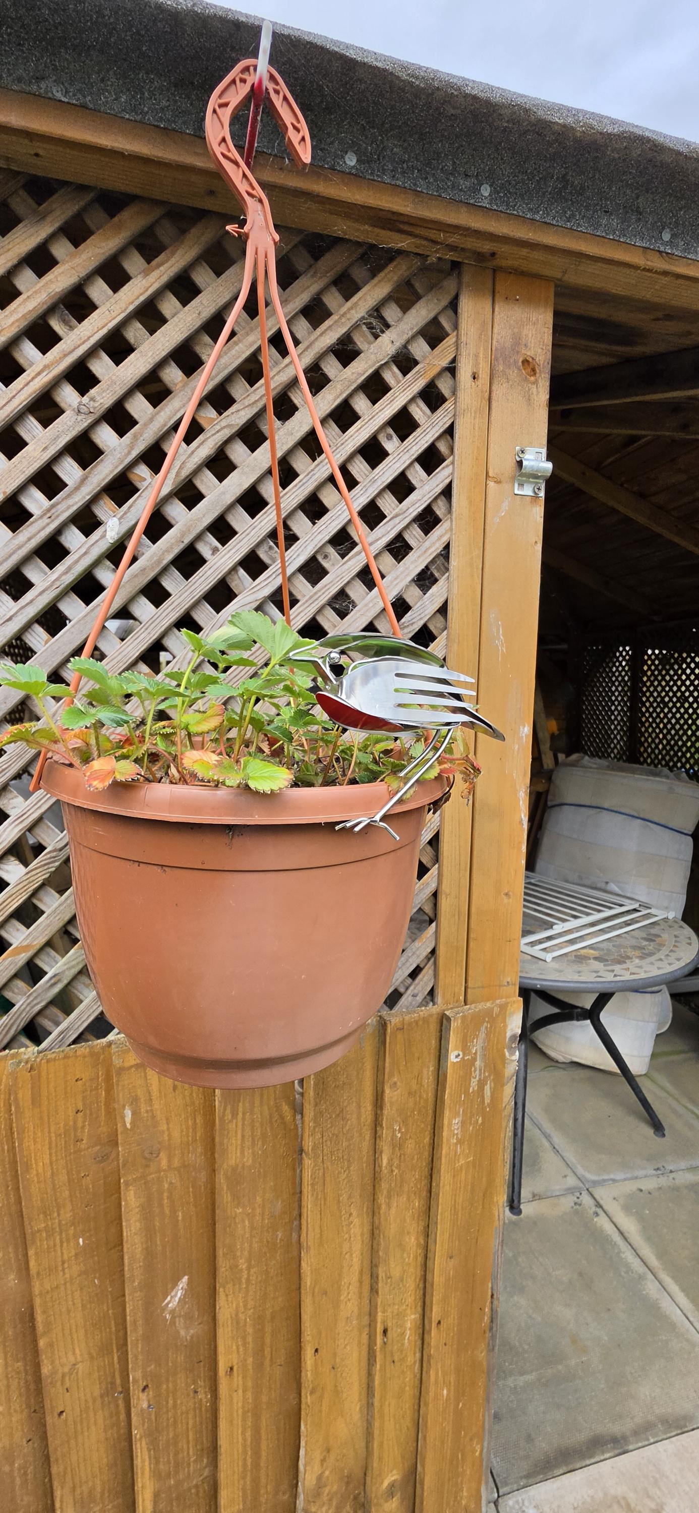 Stainless Steel Robin made from forks, and spoons.