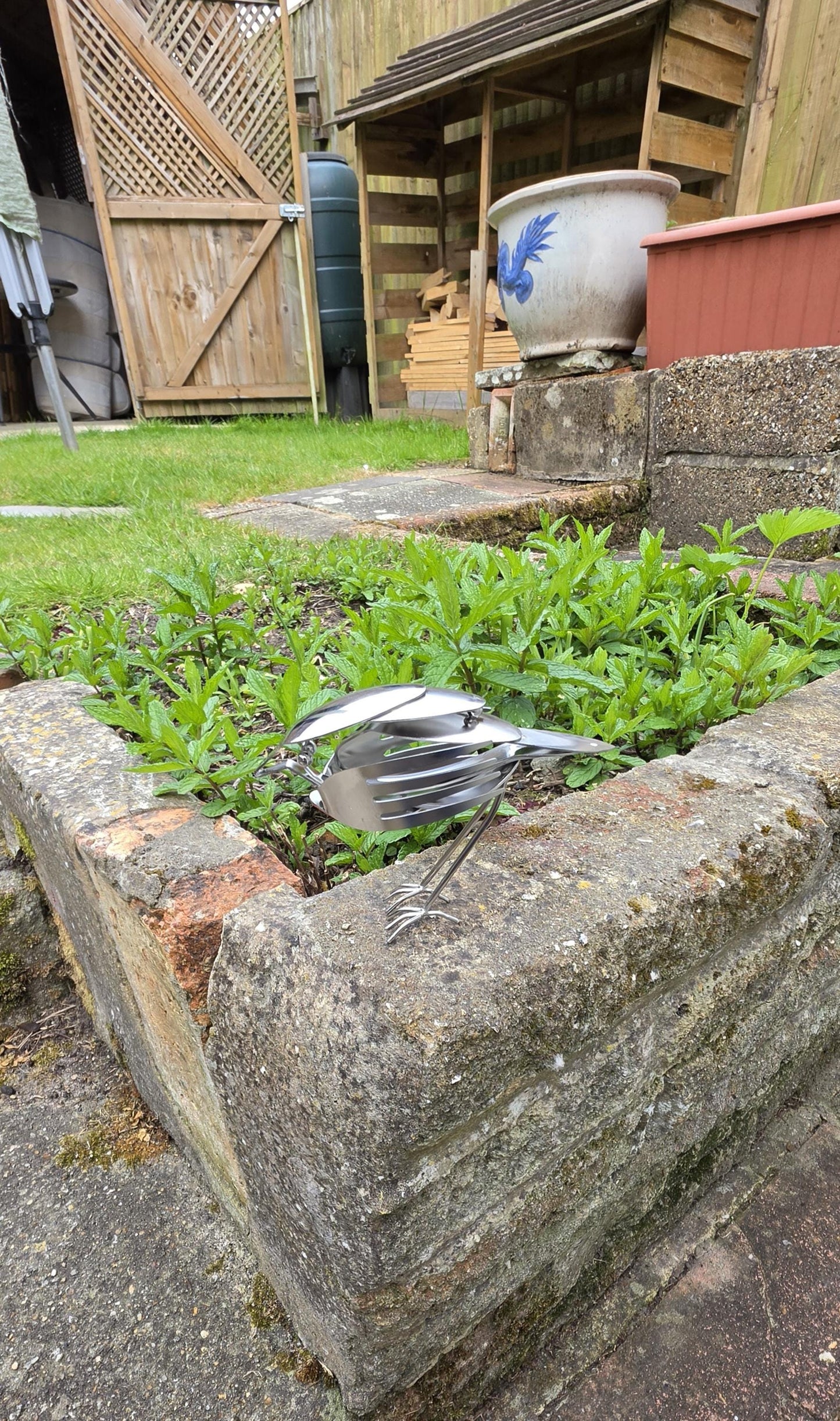 Stainless Steel Robin made from forks, and spoons.