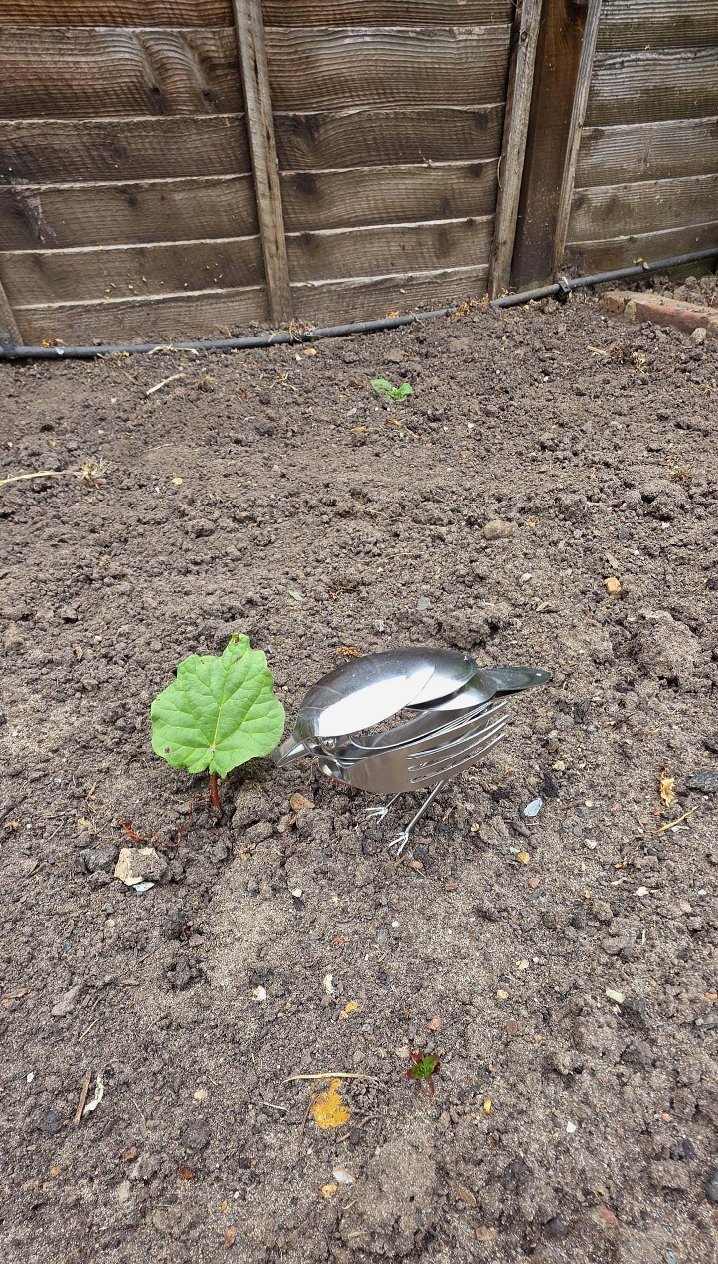 Stainless Steel Robin made from forks, and spoons.