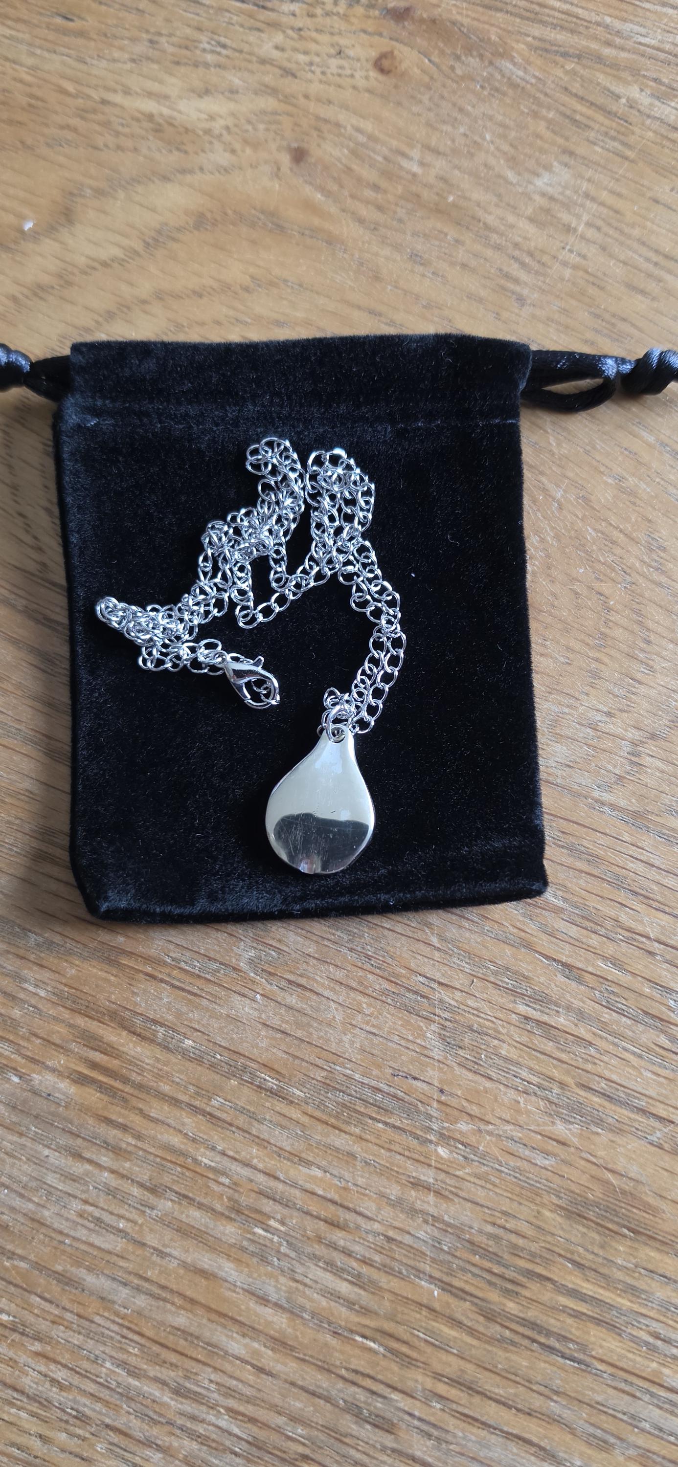 Silver plated fork made into pear shaped pendant with 20 inch stainless steel chain