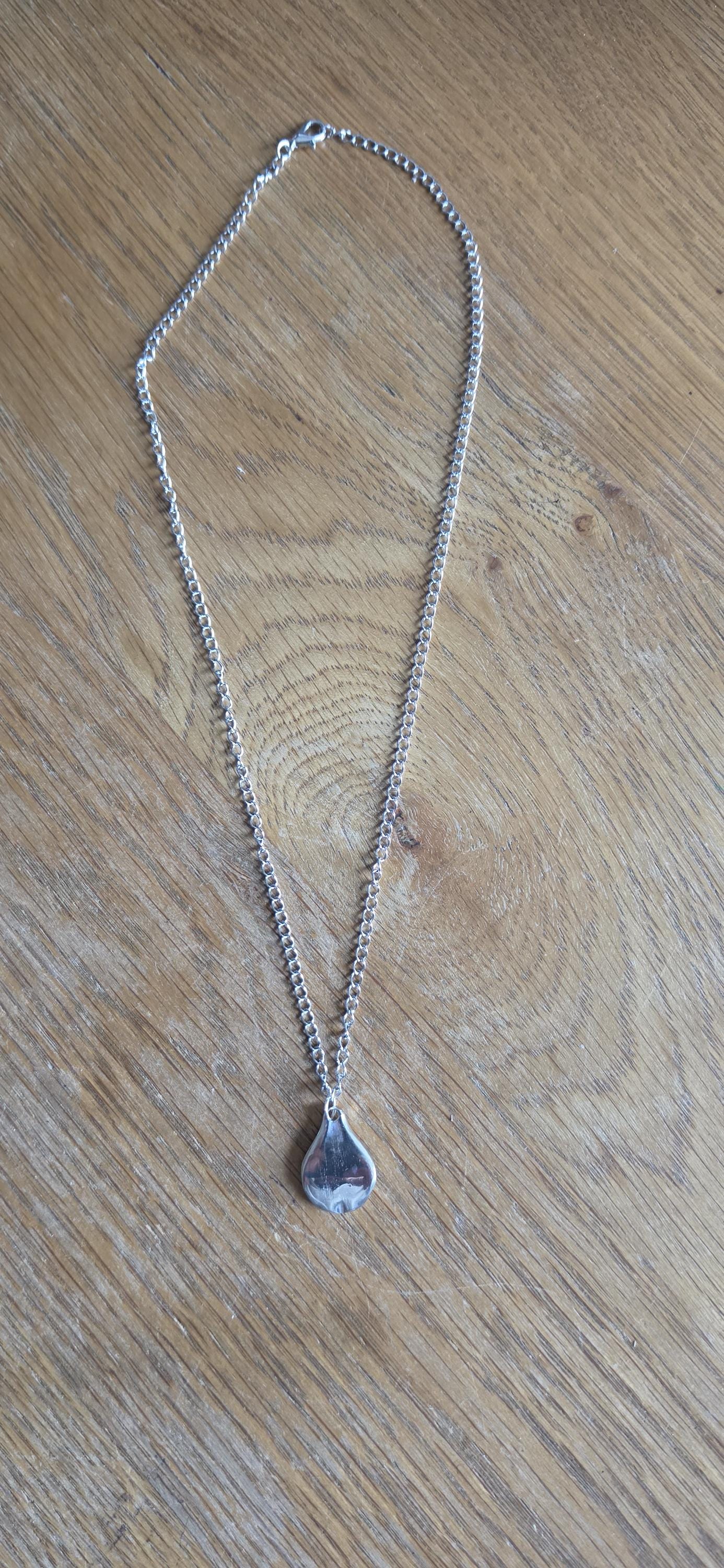 Silver plated fork made into pear shaped pendant with 20 inch stainless steel chain