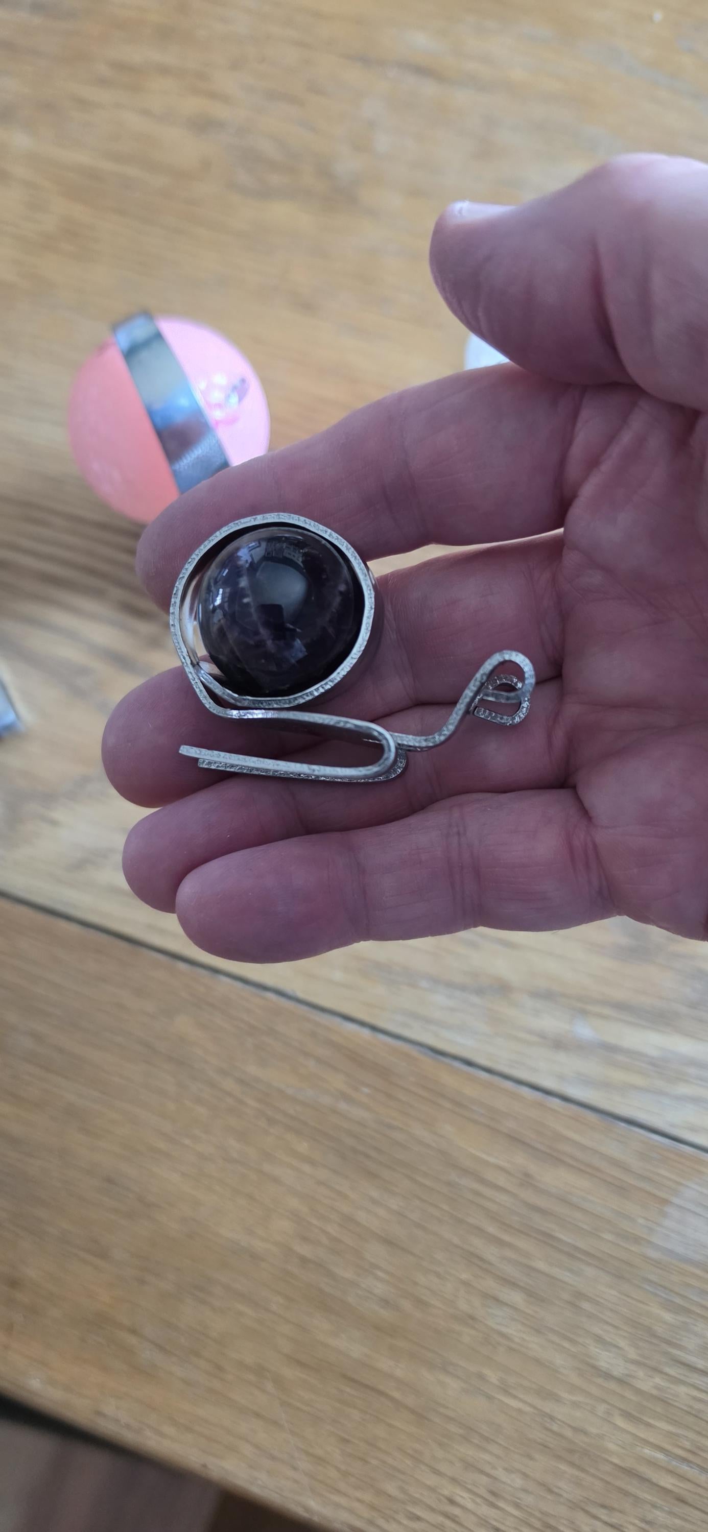 Small snail made from a dessert fork and large marble
