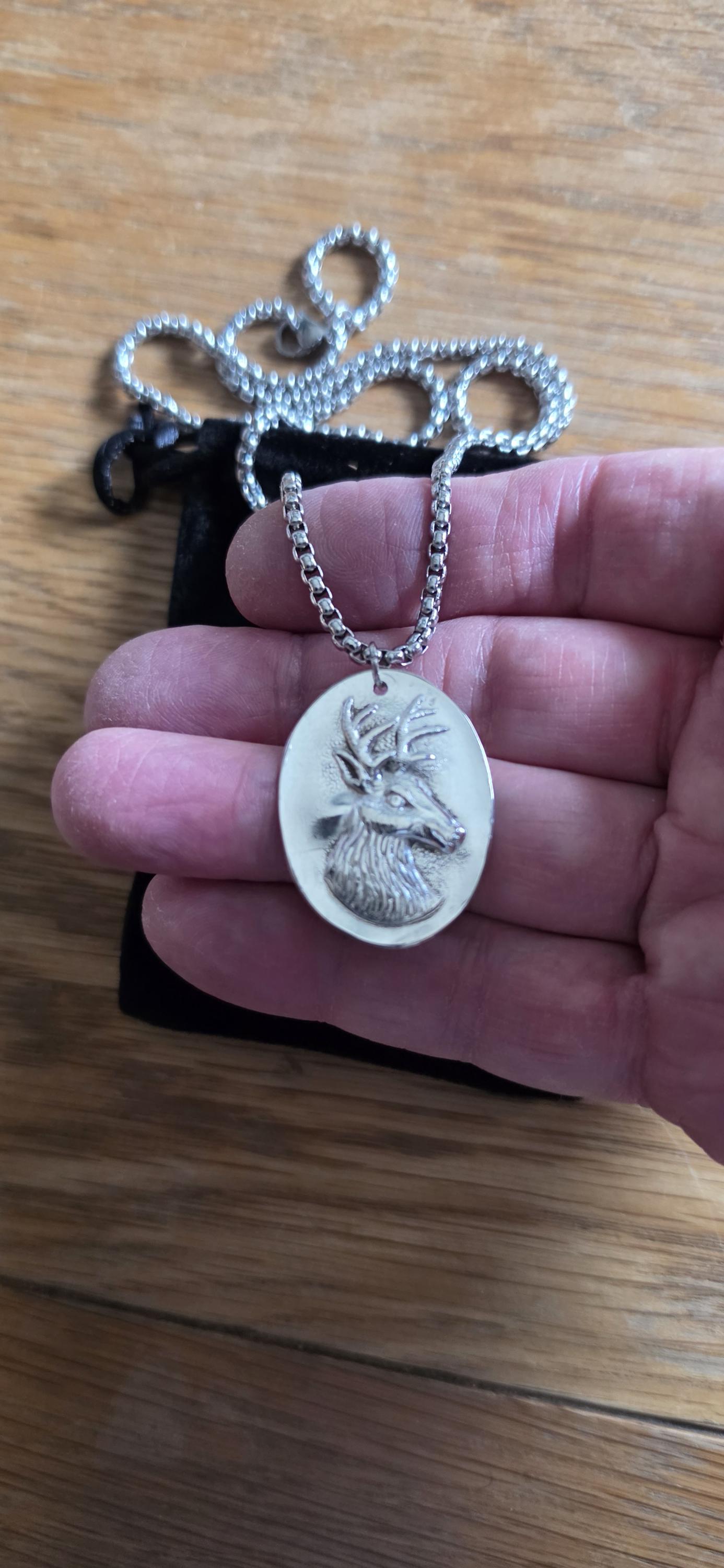 Silver plated spoon featuring stagg head and 20 inch stainless steel chain