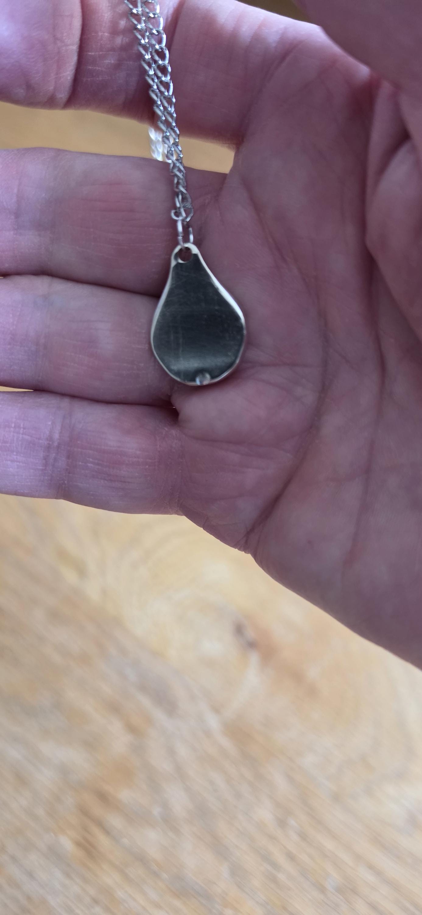 Silver plated fork made into pear shaped pendant with 20 inch stainless steel chain
