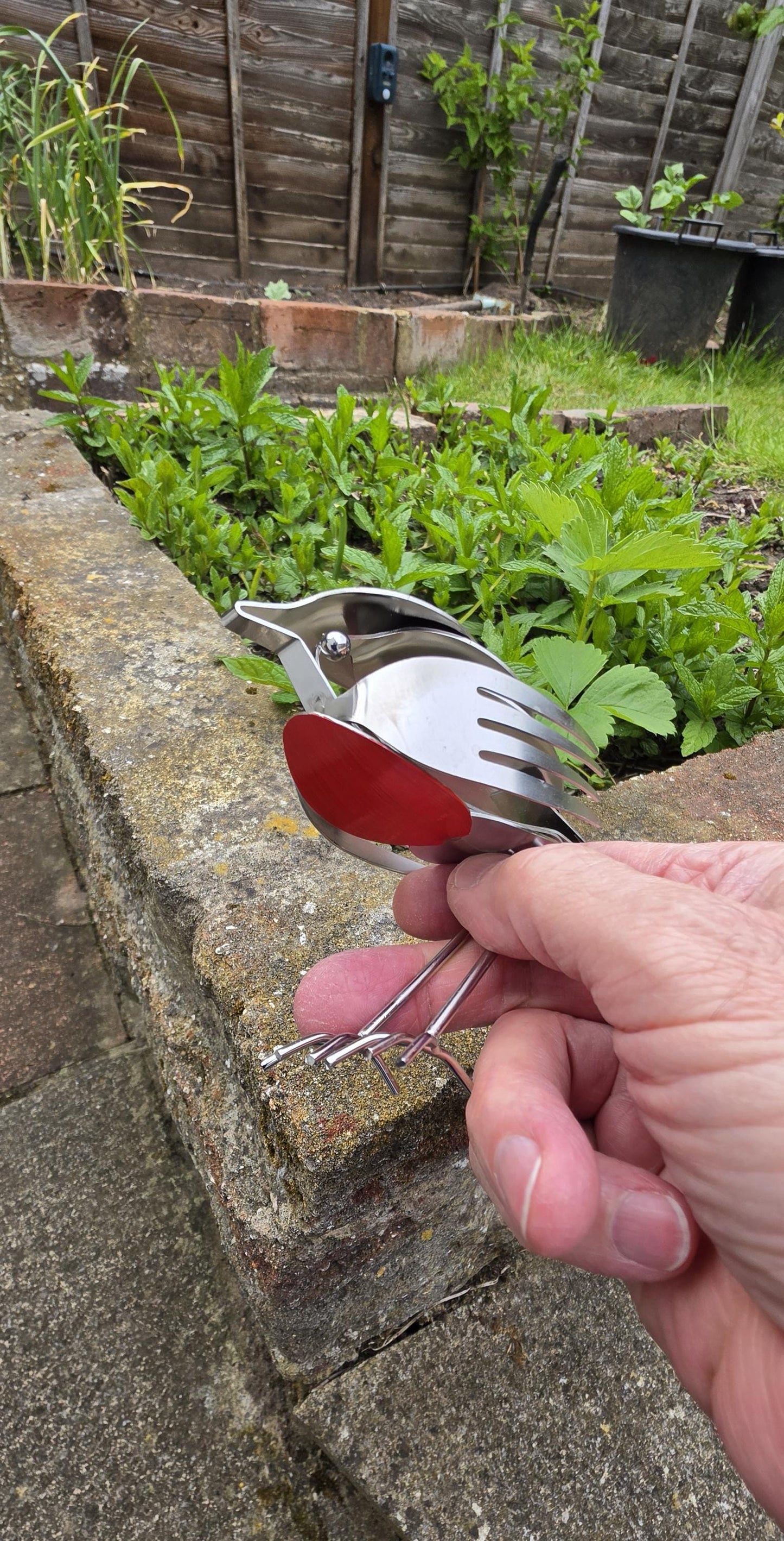 Stainless Steel Robin made from forks, and spoons.