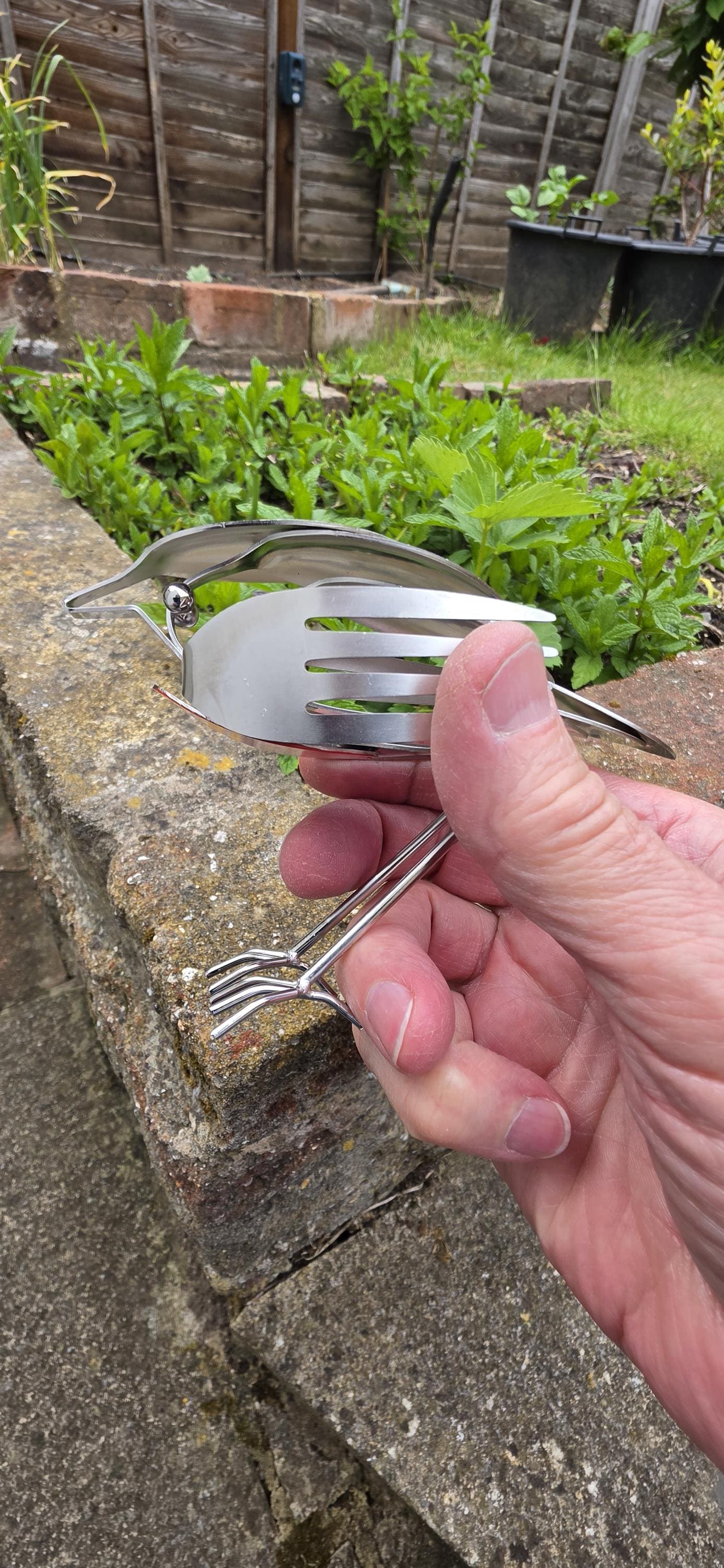 Stainless Steel Robin made from forks, and spoons.